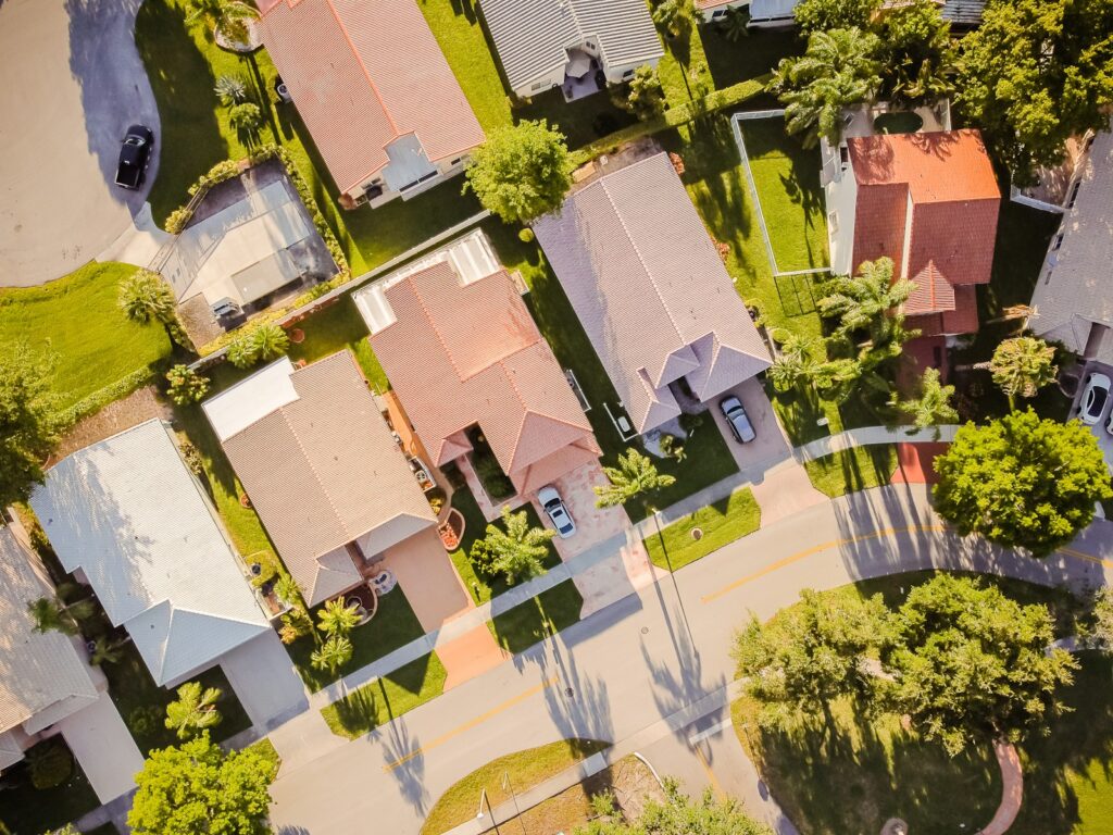 aerial view of green trees and brown concrete building